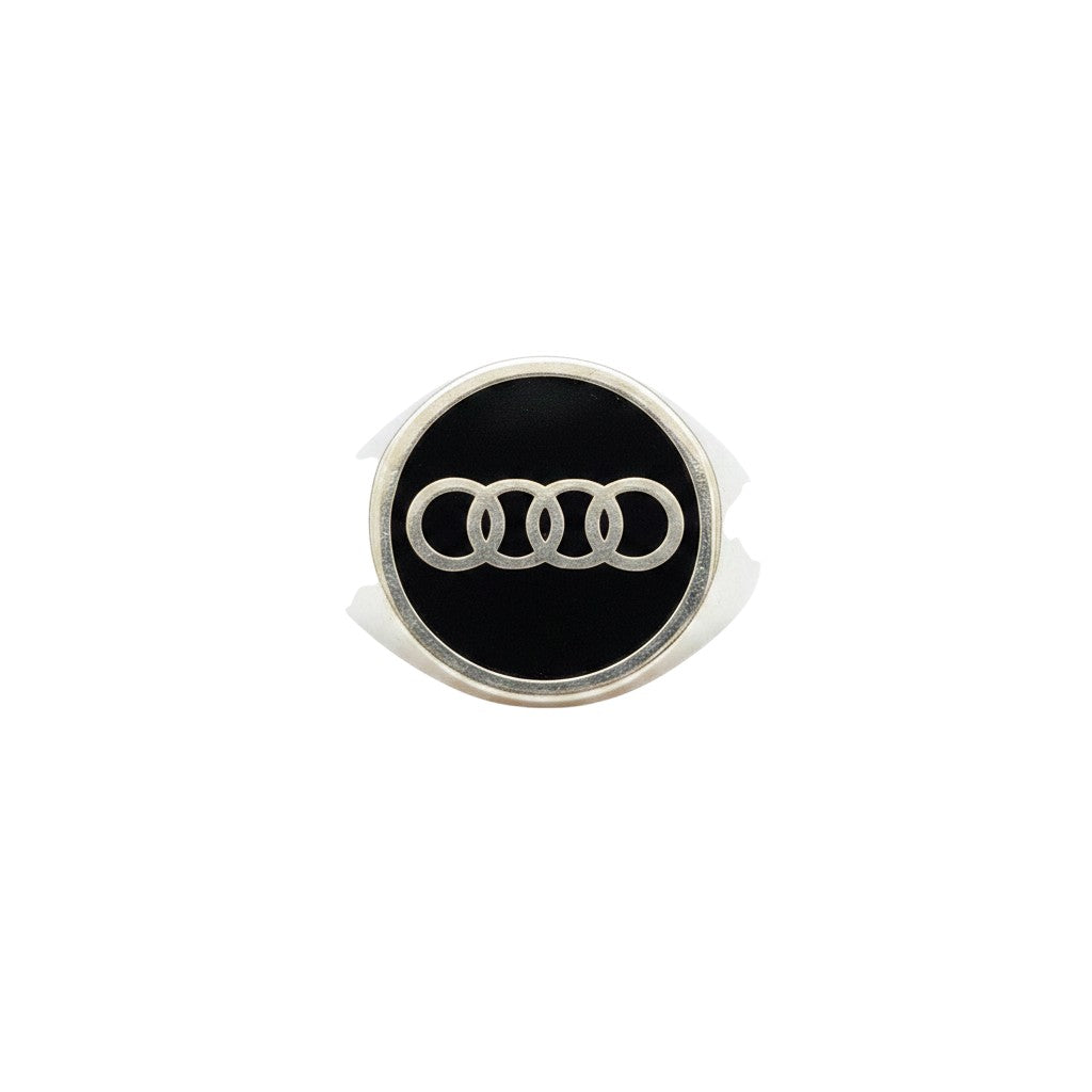 NAGPAL JEWELLERS silver signet ring with black enamel and the Audi logo. Ring size 25.
