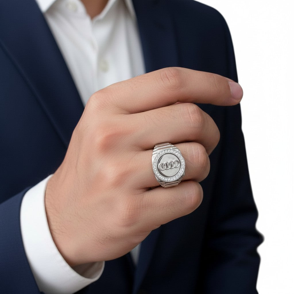 NAGPAL JEWELLERS silver rotating Audi ring for men, size 25, with diamond accents.