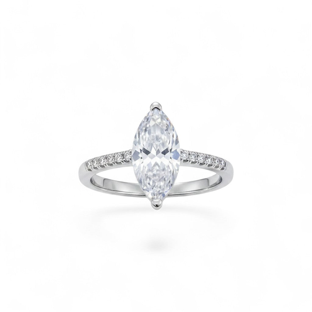 NAGPAL JEWELLERS The Grace Solitaire ring with a large marquise-cut clear stone and small stones on the band, size 15.