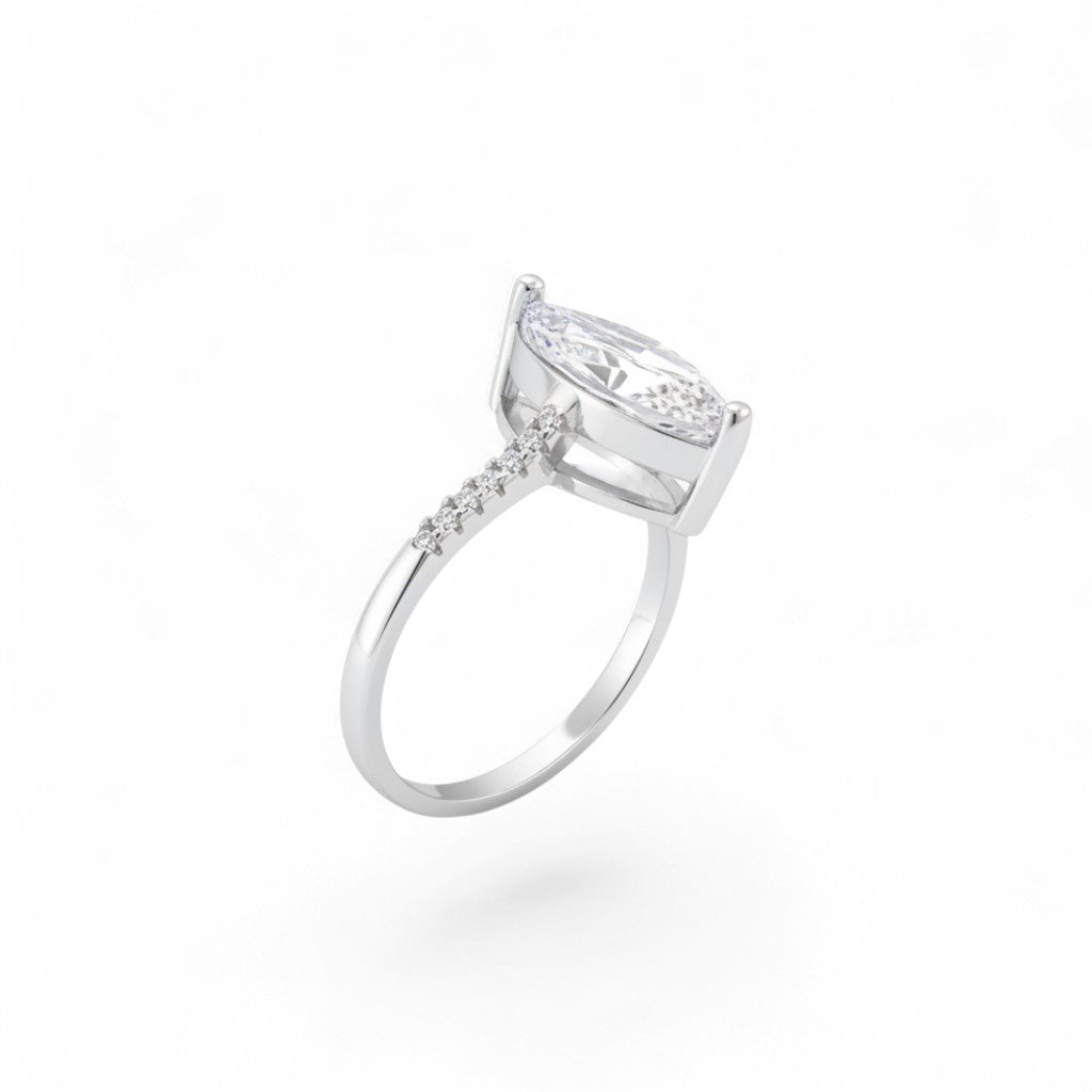 NAGPAL JEWELLERS The Grace Solitaire ring with a marquise-cut clear stone and small diamonds on the band, size 15.
