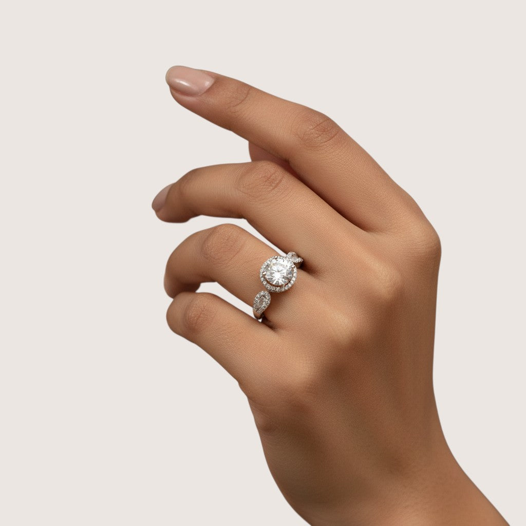 NAGPAL JEWELLERS The Graceful Halo-Split ring with a large center stone and halo of smaller stones.
