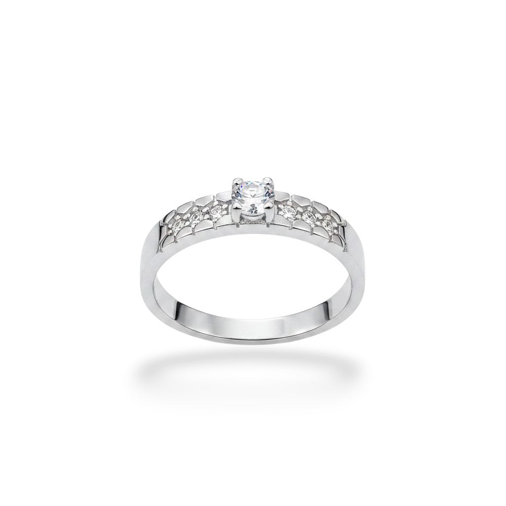 NAGPAL JEWELLERS The Lattice Grace ring with a central diamond and smaller stones on the band, size 22.