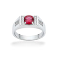 NAGPAL JEWELLERS men's silver ring with a large round red gemstone and small clear accent stones.
