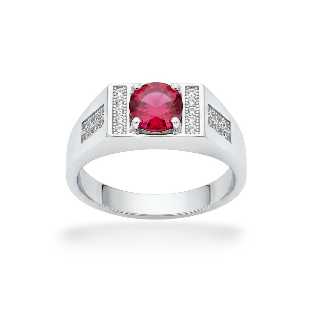 NAGPAL JEWELLERS men's silver ring with a large round red gemstone and small clear accent stones.