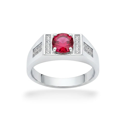 NAGPAL JEWELLERS men's silver ring with a large round red gemstone and small clear accent stones.
