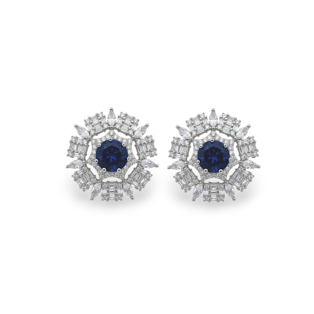 NAGPAL JEWELLERS Midnight Radiance Discs, 92.5 silver stud earrings with deep blue center stone and clear baguette and marquise cut stones.