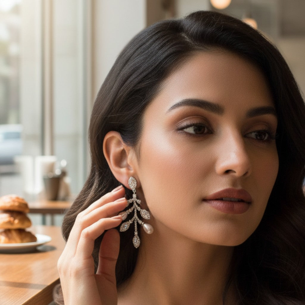 NAGPAL JEWELLERS Moonlit Petal Earrings: 92.5 silver drop earrings with pearl and crystal leaf design.