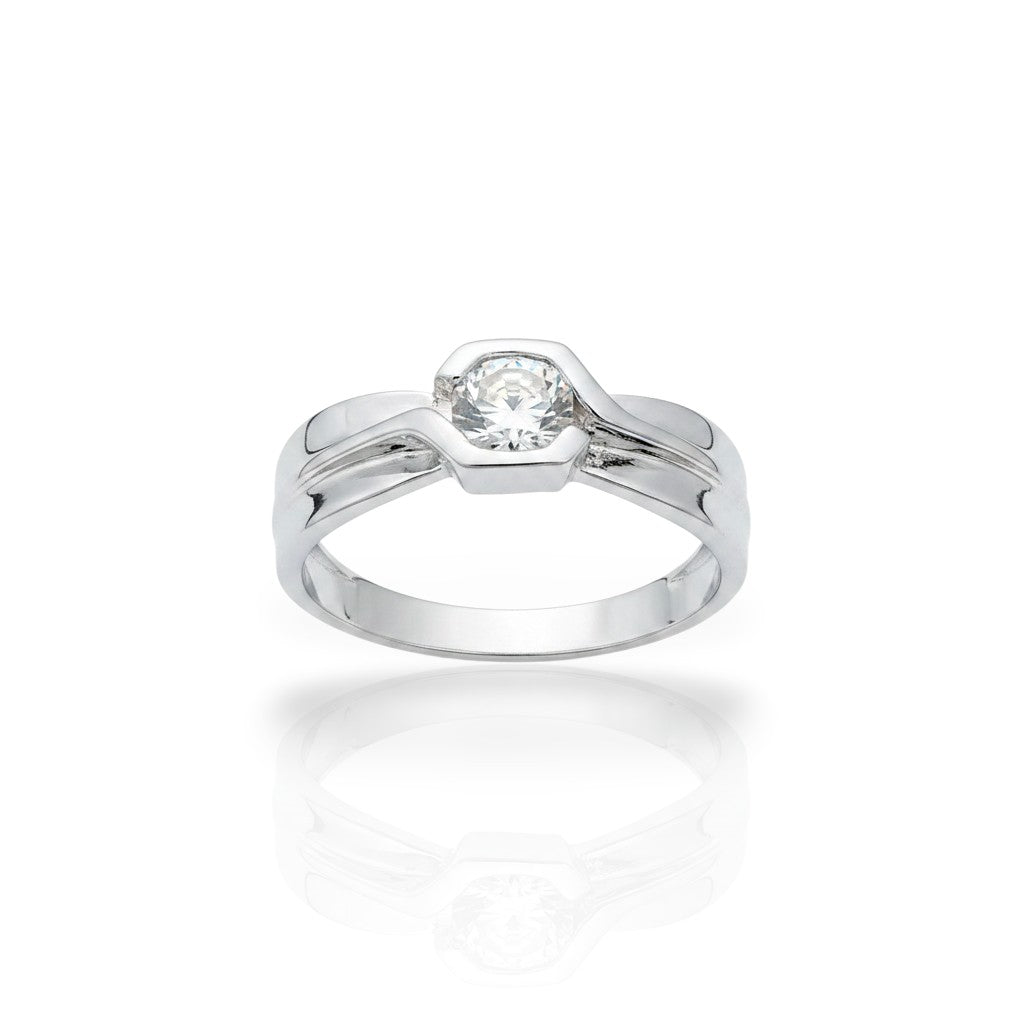 NAGPAL JEWELLERS The Sculpted Ring, a silver band with a geometric setting holding a clear, round-cut gemstone. Ring size 21.