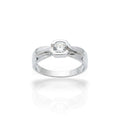 NAGPAL JEWELLERS The Sculpted Ring, a silver band with a geometric setting holding a clear, round-cut gemstone. Ring size 21.