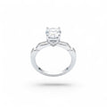 NAGPAL JEWELLERS Serpentine Sparkle ring with a large clear stone and small accent stones on a twisted band.