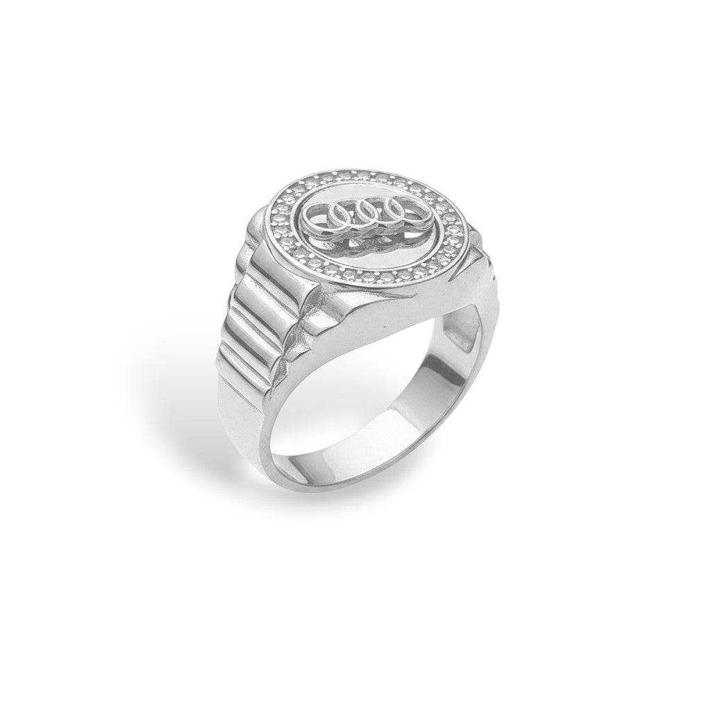NAGPAL JEWELLERS silver rotating Audi ring for men, size 25, with diamond accents and ribbed band.