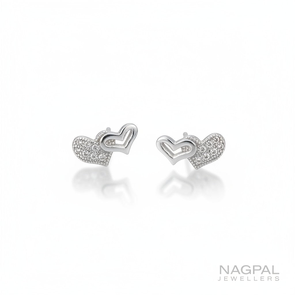 NAGPAL JEWELLERS sterling silver double heart stud earrings with pave set cubic zirconia.