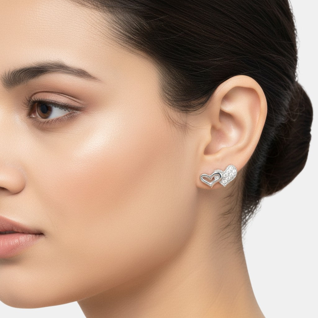 NAGPAL JEWELLERS sterling silver double heart stud earrings with pave cubic zirconia.