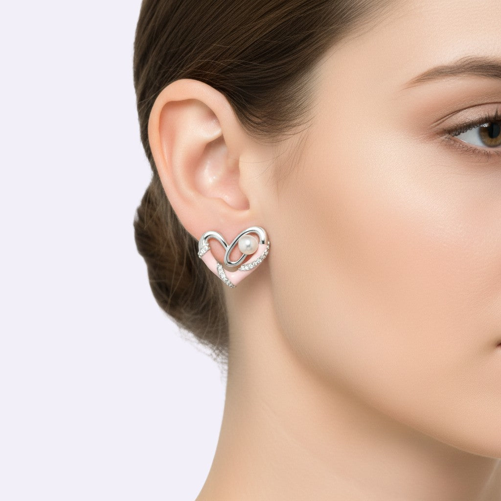 NAGPAL JEWELLERS silver heart earrings with pink enamel, pearls, and small crystals. Perfect for gifting.