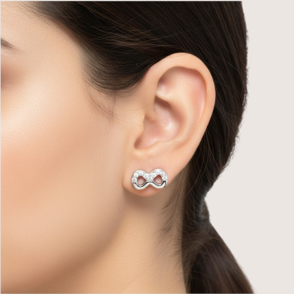 NAGPAL JEWELLERS silver 92.5 infinity stud earrings with clear stones. Perfect for gifting.