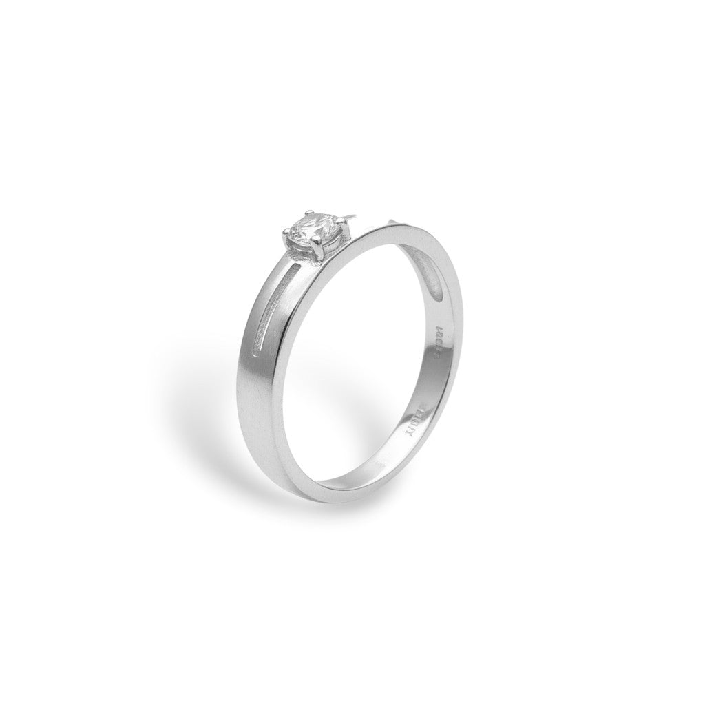 NAGPAL JEWELLERS silver ring with a clear stone and a cutout band design.