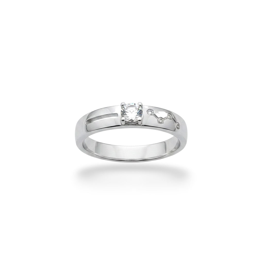NAGPAL JEWELLERS silver ring with a clear stone and intricate side detailing.
