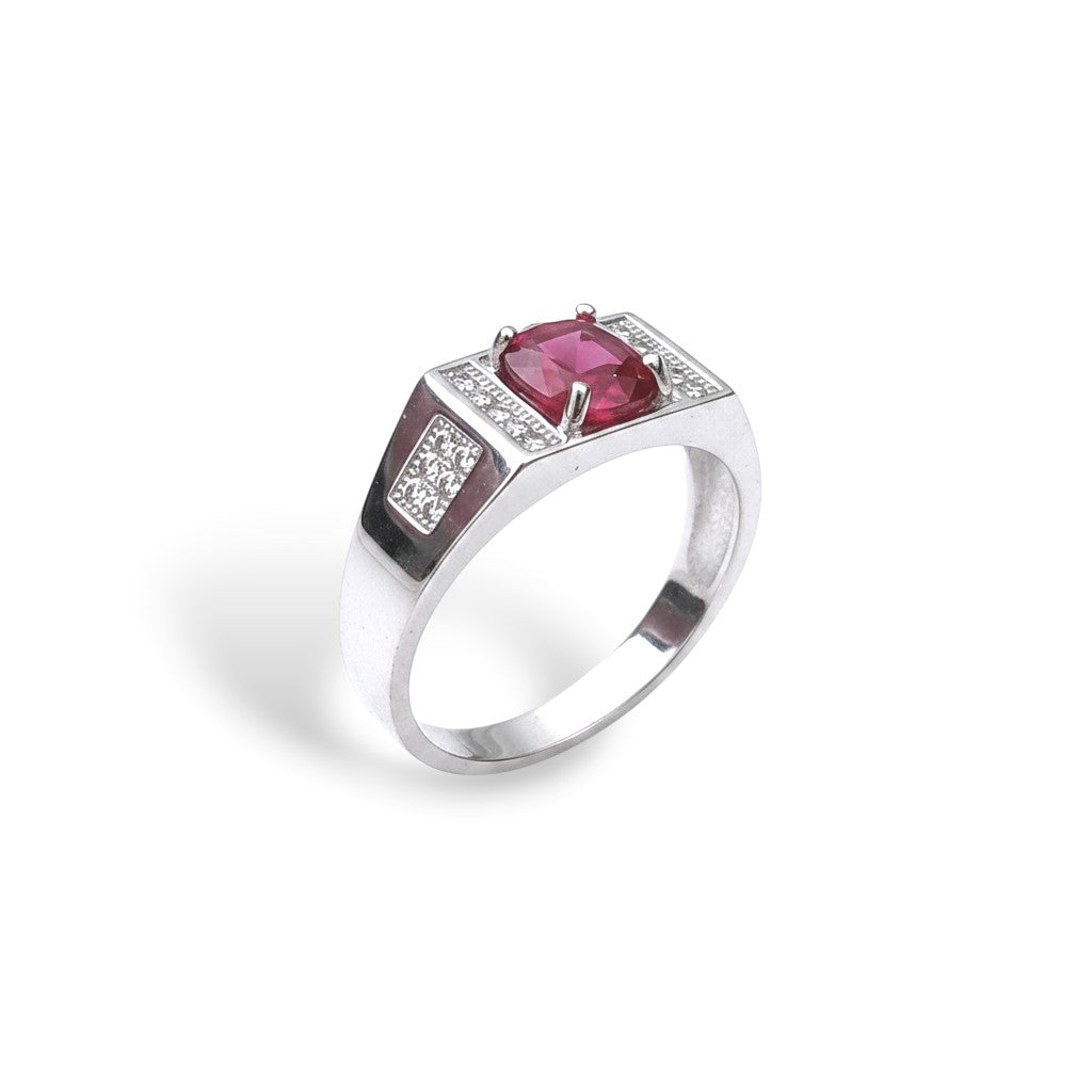 NAGPAL JEWELLERS men's silver ring with a large square-cut red gemstone and small clear accent stones.