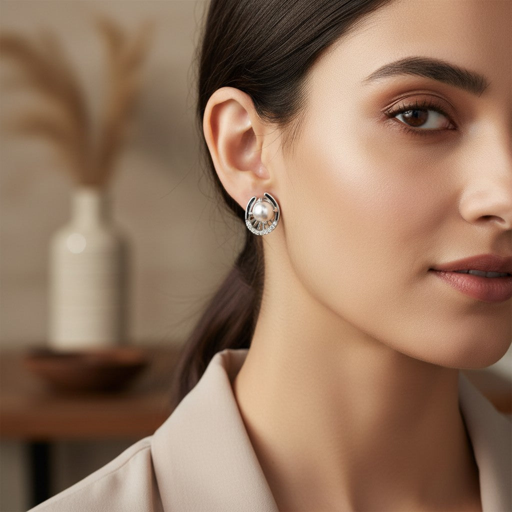 NAGPAL JEWELLERS Silver Trinity Studs with pearls and cubic zirconia accents.