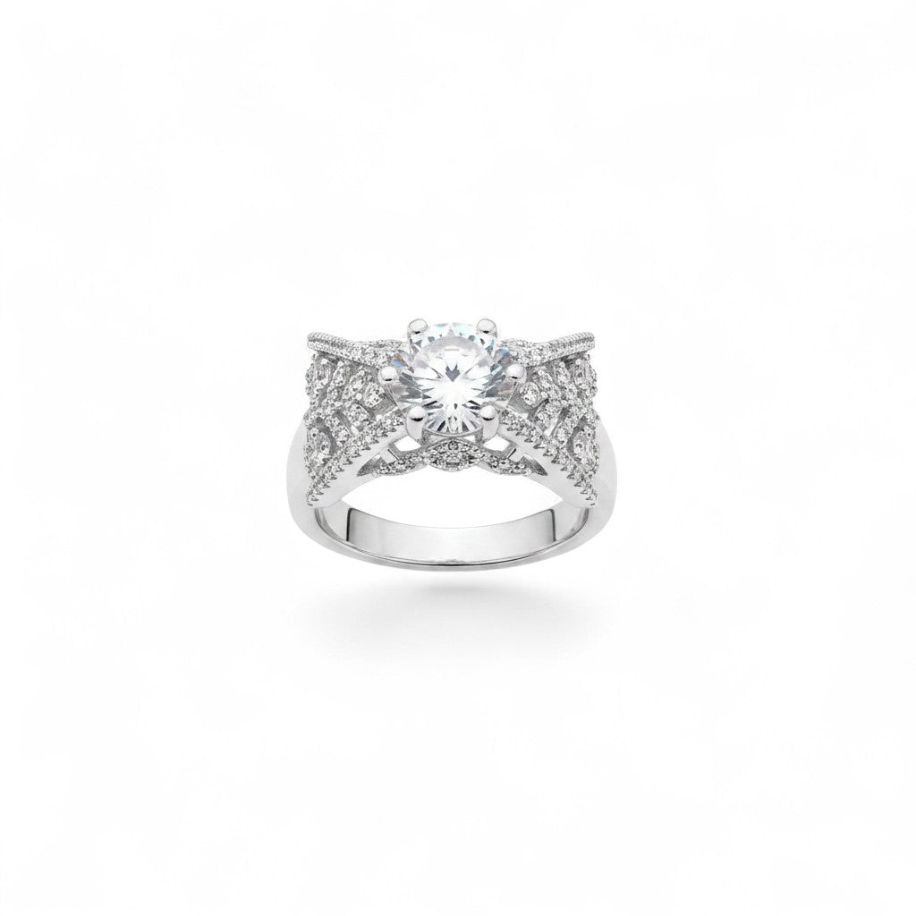 NAGPAL JEWELLERS The Tiara Bridge ring, size 16, featuring a large round-cut center stone surrounded by intricate pave detailing on a silver-tone band.