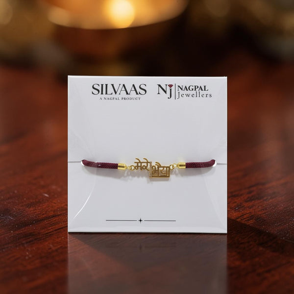 SILVAAS gold-toned Mere Bhaiya Rakhi on a white display card with maroon thread for Raksha Bandhan