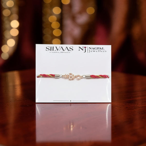 SILVAAS premium silver #Bro Rakhi featuring a sparkling hashtag charm on a maroon and gold thread display card