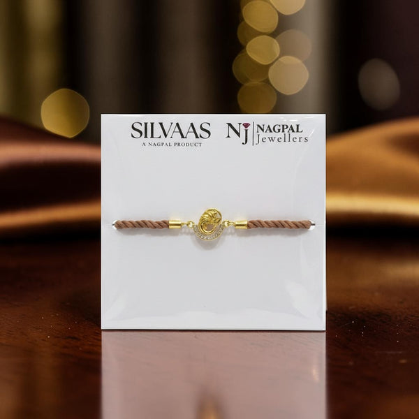 SILVAAS premium silver Ganesh Ji Rakhi with a gold-toned Ganesha motif on a brown braided thread for Raksha Bandhan