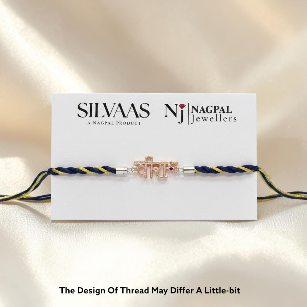 SILVAAS premium silver Veera Rakhi featuring a delicate metallic centerpiece on a blue and gold braided thread