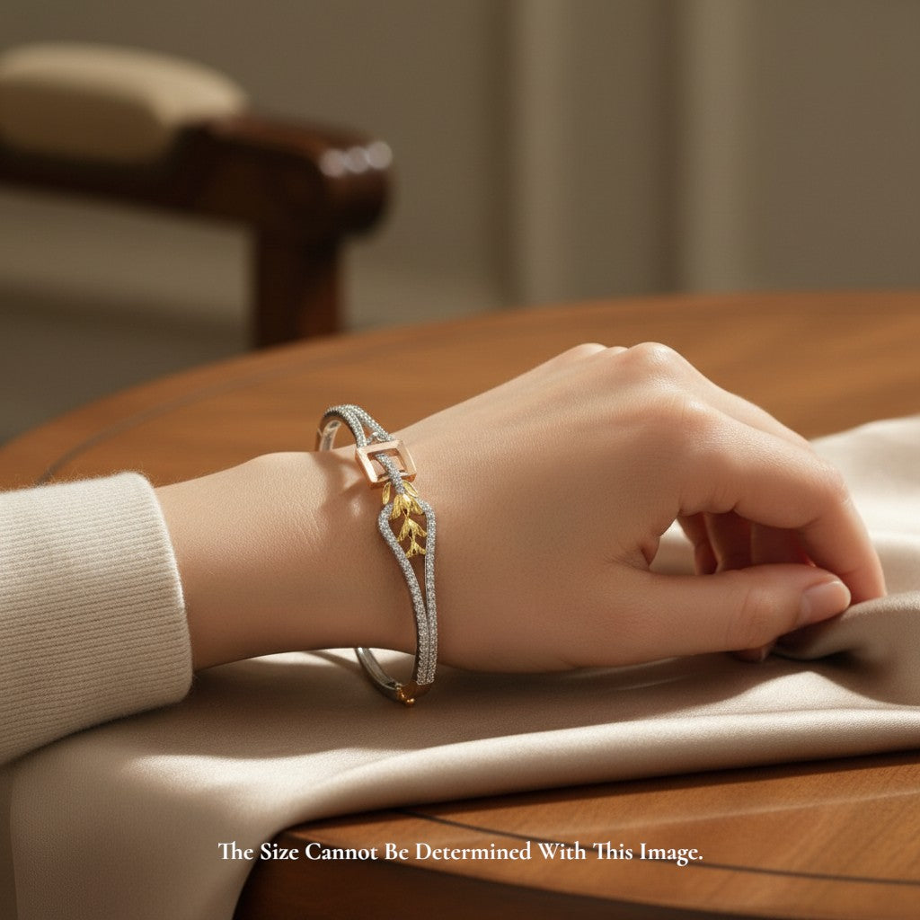 SILVAS AFA bracelet featuring a two-tone gold and diamond-encrusted design worn on a woman's wrist