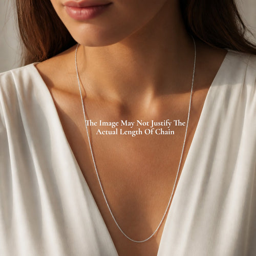 SILVAS delicate silver chain necklace worn by a woman in a white blouse