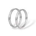 SILVAS pair of silver-tone bangles featuring baguette-cut cubic zirconia stones in a polished metal setting