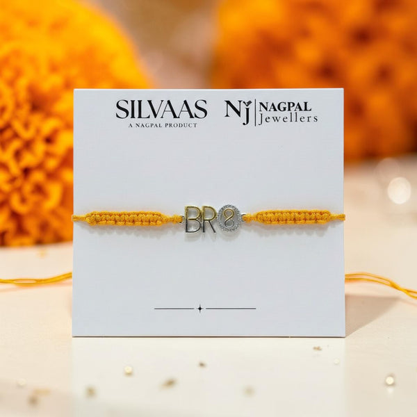 SILVAS sterling silver BRO rakhi bracelet with yellow braided thread on a branded display card