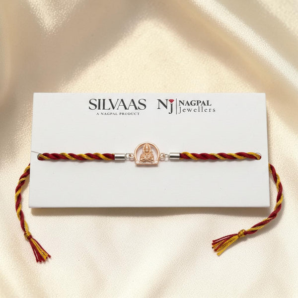 SILVAS 92.5 sterling silver rakhi featuring a deity charm on a red and yellow braided thread on a display card