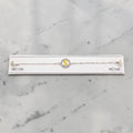 SILVAS 92.5 sterling silver bracelet featuring a circular charm with a yellow letter S on a white marble background
